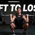 A man executing a heavy barbell squat in a gym, demonstrating the best weight lifting routine to lose weight with a MenVitaly watermark.